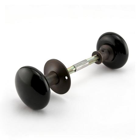 Vertical Brass Rim Lock Set with Black Porcelain Knobs