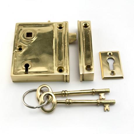 Vertical Brass Rim Lock Set with Porcelain Knobs - Right Hand - Polished Brass