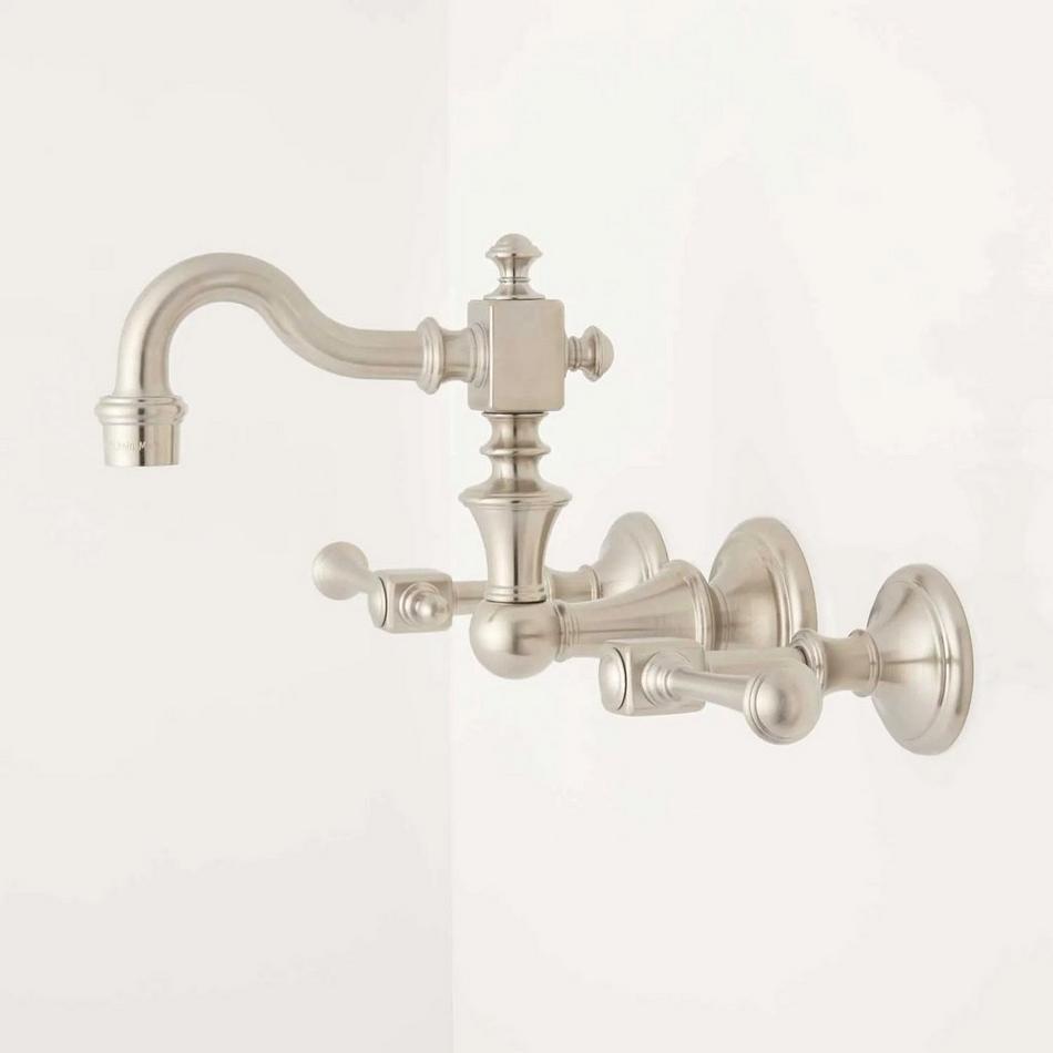https://images.signaturehardware.com/i/signaturehdwr/443969-wall-mount-bathroom-faucet-lever-handles-satin-nickel-side.jpg?w=950&fmt=auto