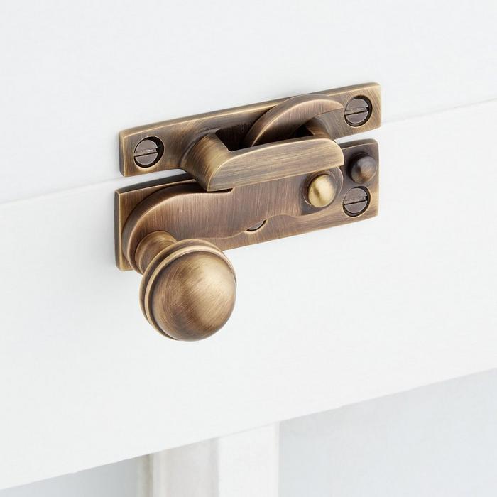 Victorian Brass Sash Lock in Antique Brass for mid-century modern style window hardware