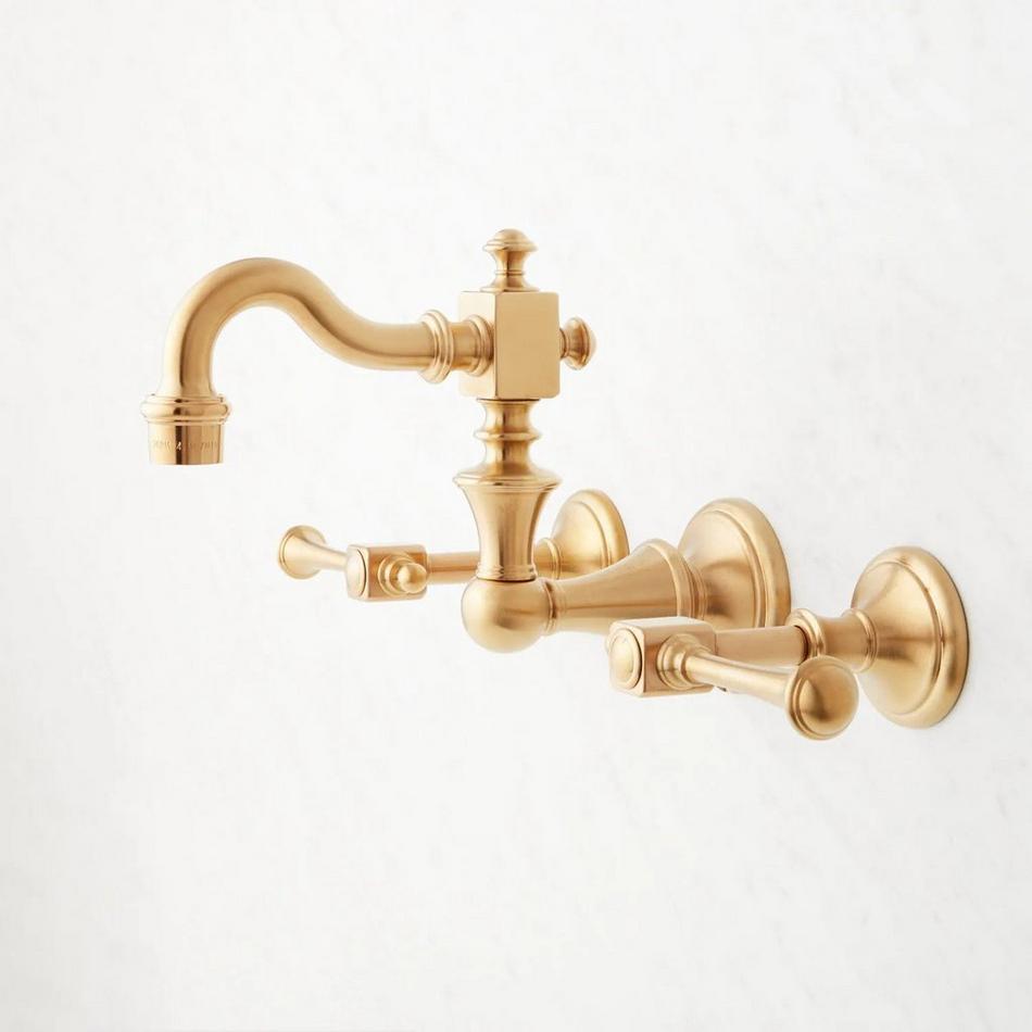 https://images.signaturehardware.com/i/signaturehdwr/504110-vintage-wall-mount-bathroom-faucet-lever-handles-brushed-gold-side_1.jpg?w=950&fmt=auto