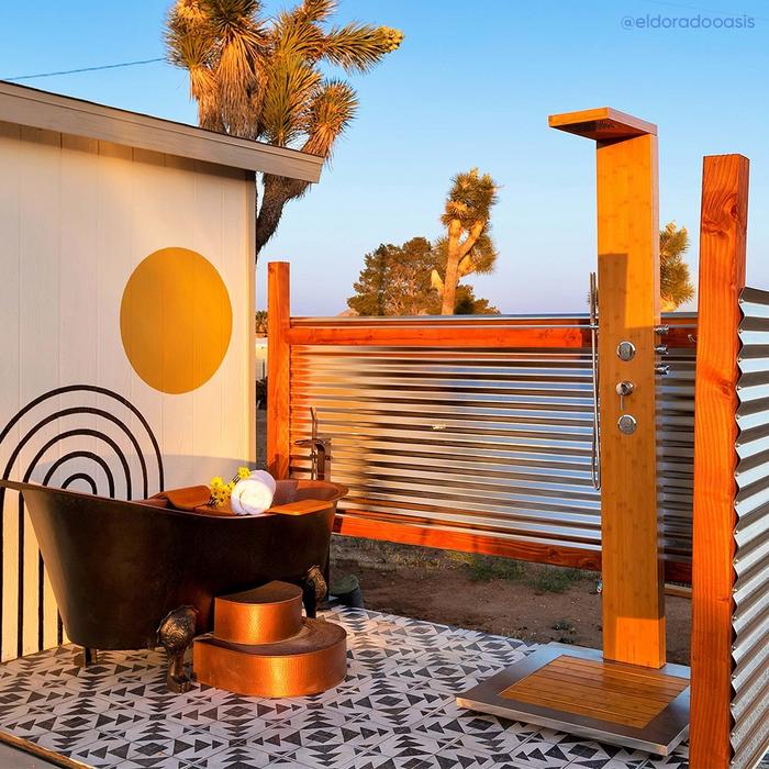 Outdoor bathroom from The Eldorado Oasis, McQuire Copper Clawfoot Tub, Murray Outdoor Bamboo Shower Panel, Orsen Maple Tub Caddy