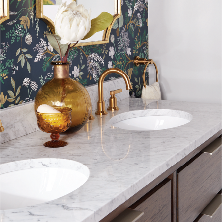 bathroom vanity with brass faucets
