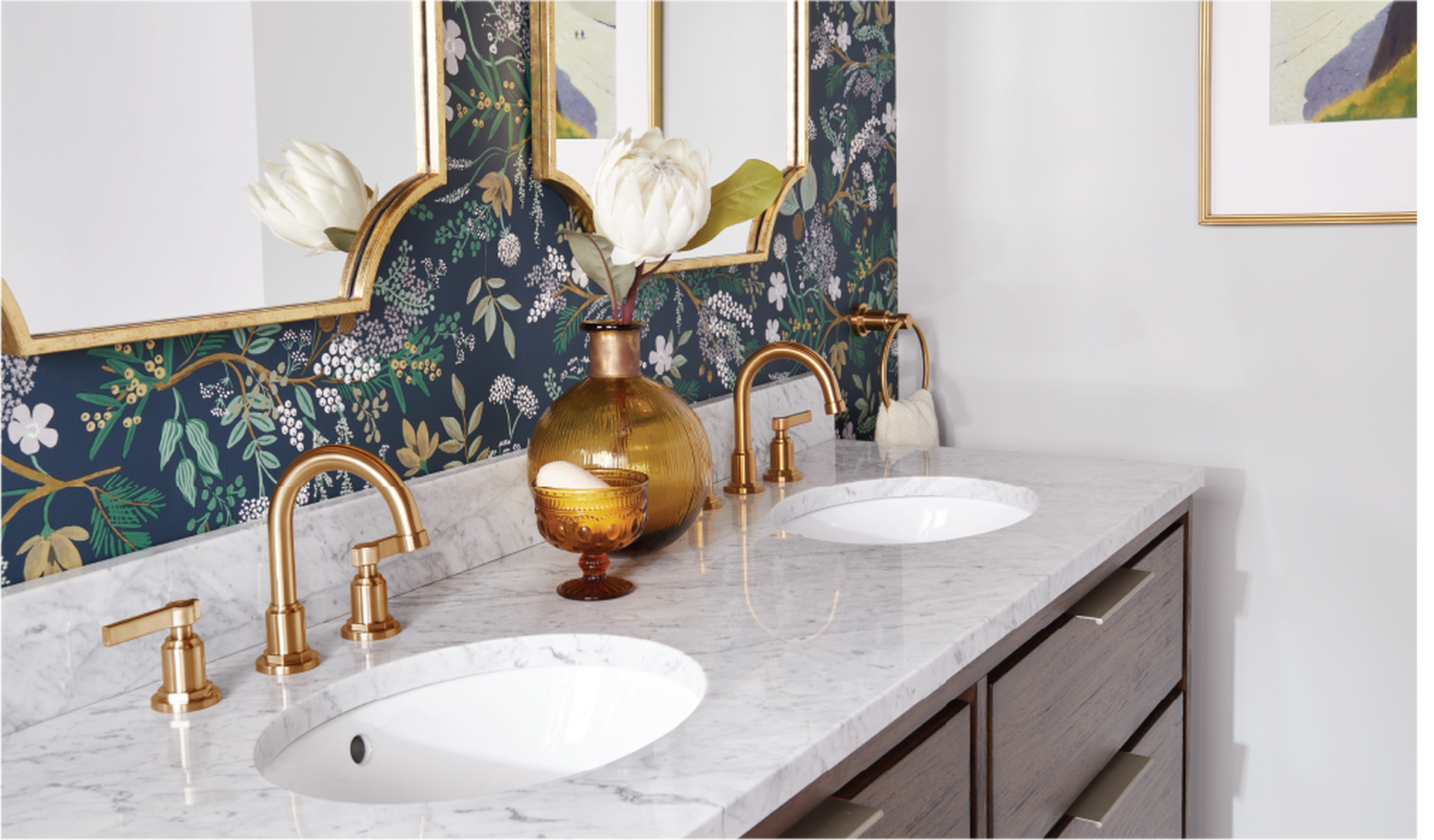 bathroom vanity with brass faucets