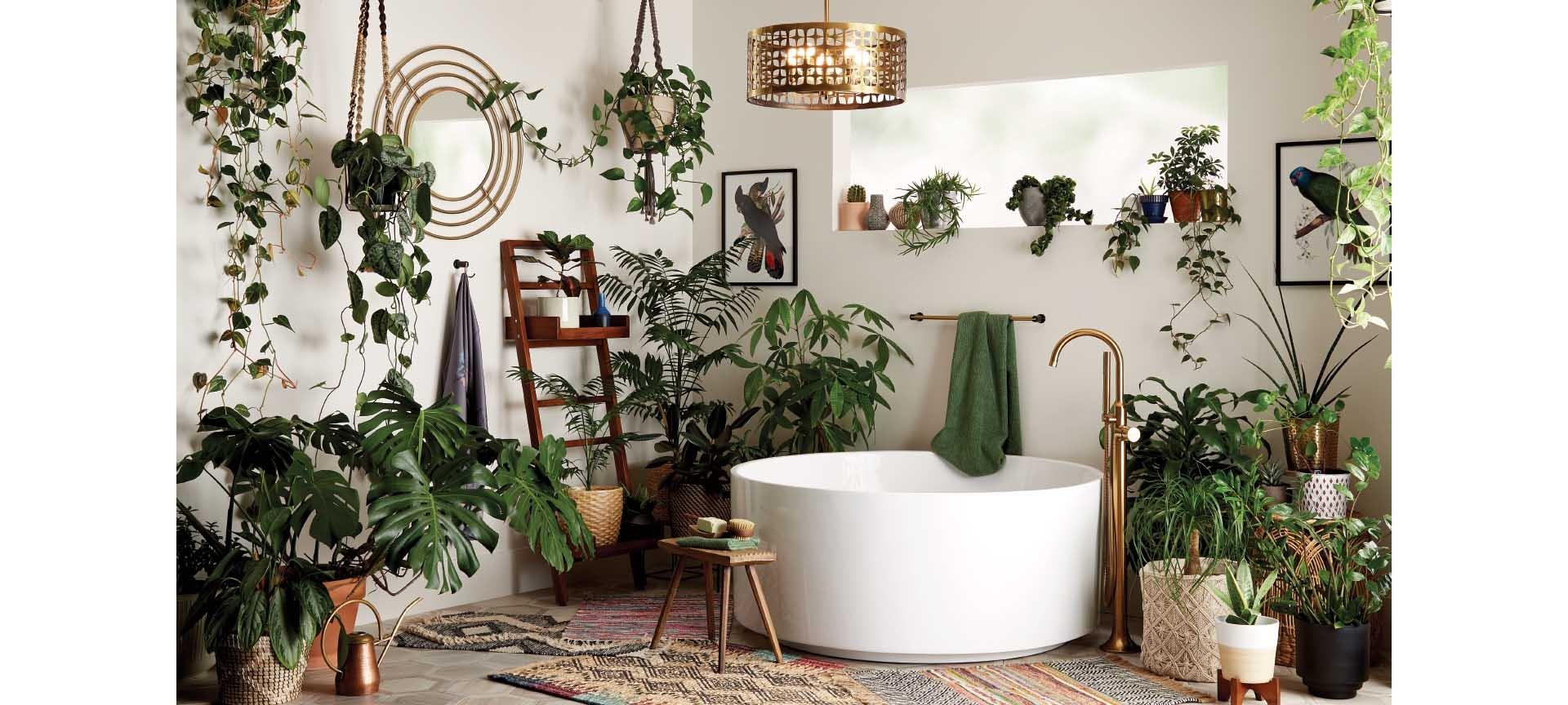 Bohemian style bathroom with 55" Dempsey Round Acrylic Freestanding Tub, Lentz Freestanding Tub Faucet in Brushed Gold