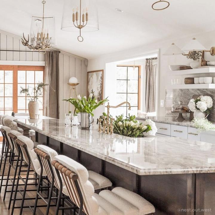 Kitchen of Cait Pappas featuring the Bellevue Bridge Kitchen Faucet With Sprayer in Polished Brass