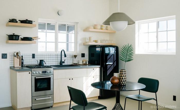 Kitchen by Airbnb designer Carlos Naude & Whitney Brown with 24" Holcomb Drop-In Sink, Wing Nut Basket Strainer in Flat Black
