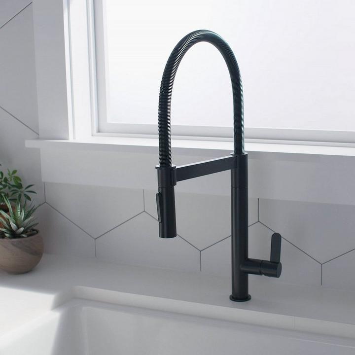 Ocala Single-Hole Kitchen Faucet with Pull-Down Spring Spout in Matte Black on kitchen countertop