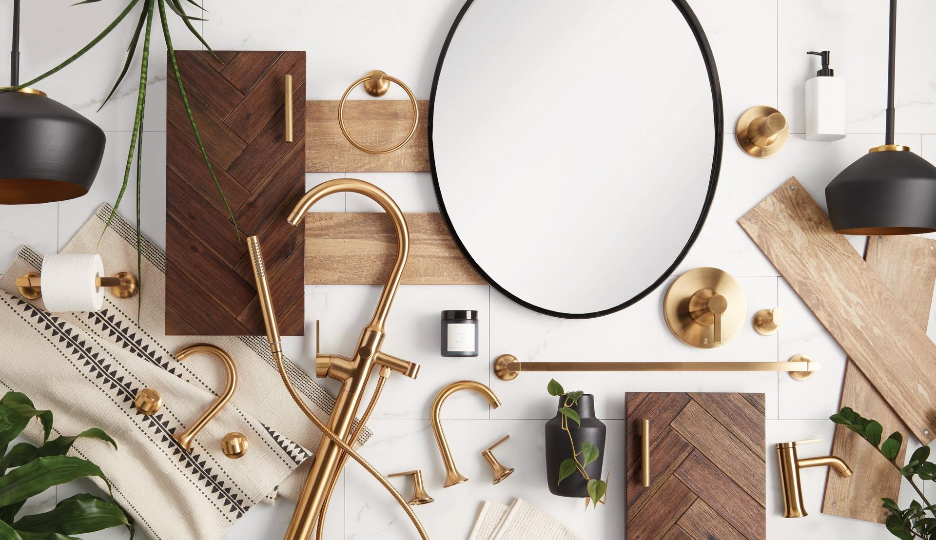 collection of gold faucets and other bathroom hardware