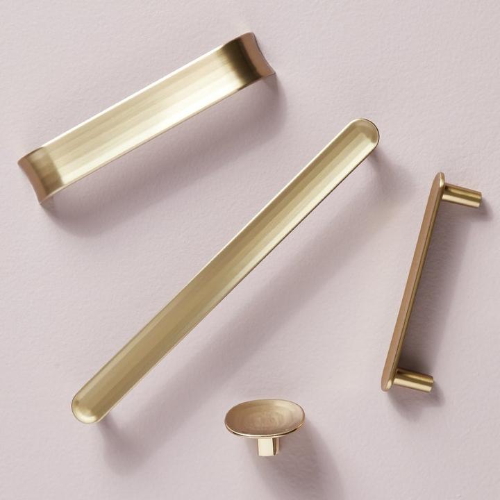 Dolorue Arched & Bar Cabinet Pull, Finger Pull, & Cabinet Knob in Golden Champagne