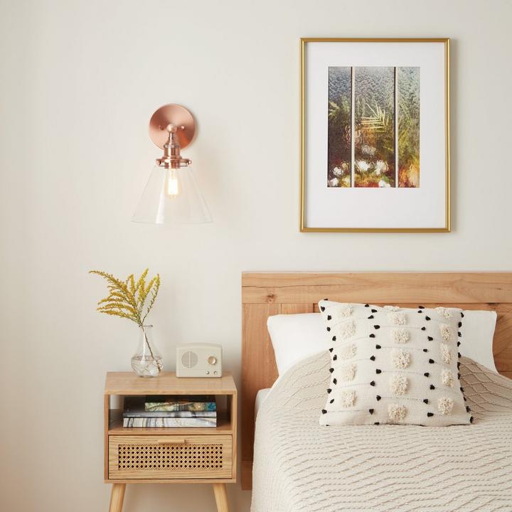 Use Barwell Vanity Sconce in Satin Copper as a creative lighting idea to complement art work