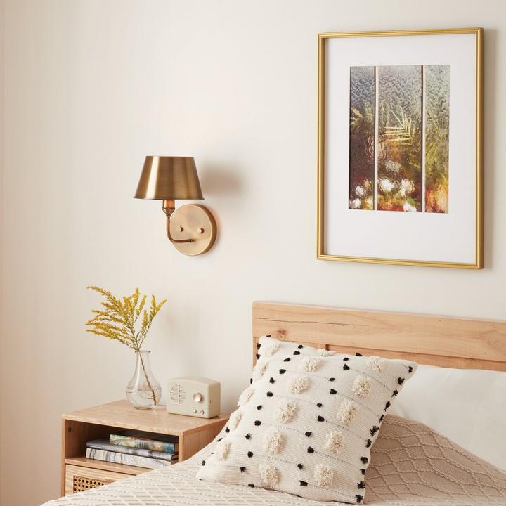 Stanburn Vanity Sconce Single Light in Aged Brass provides convenient bedside lighting