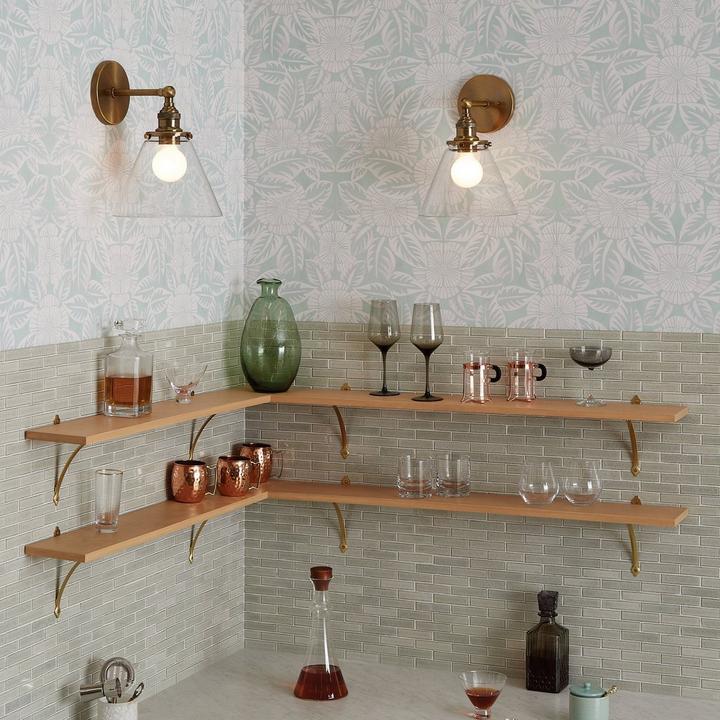 Barwell Vanity Sconce in Satin Copper adds visibility to open shelving in a kitchen