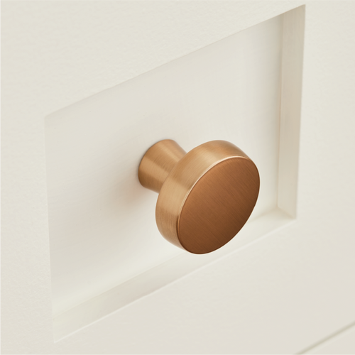 Bauman Round Cabinet Knob in Champagne Bronze