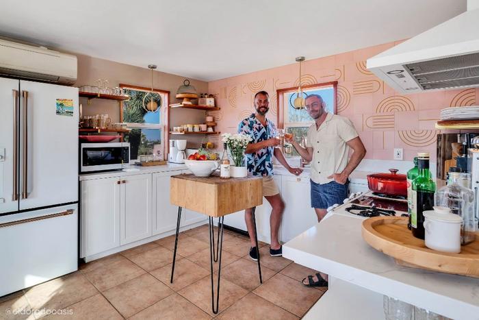 Kit Williamson and John Halbach of El Dorado Oasis standing in their kitchen featuring the Solid Bronze Textured Square Knob