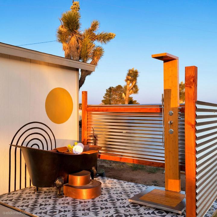 Outdoor shower of El Dorado Oasis with the Willis Freestanding Waterfall Tub Faucet in Chrome