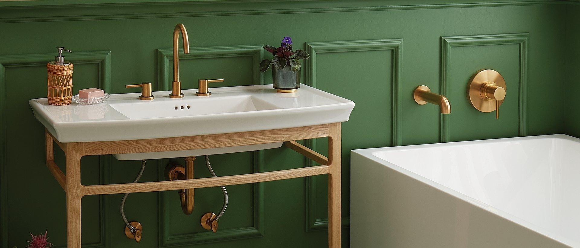 console sink with gold widespread faucet