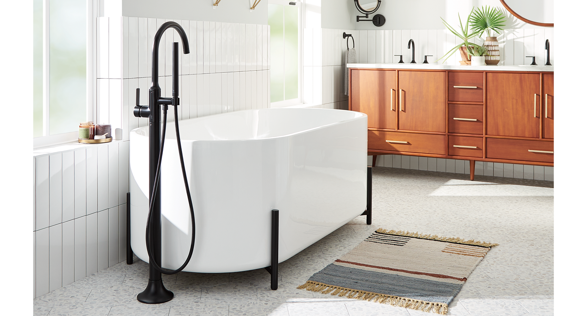 Modern bathroom with freestanding bathtub, modern taps and blue