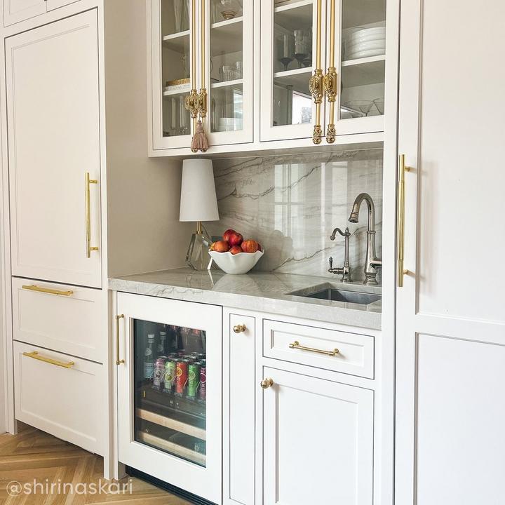 Gourmet kitchen with the Dalston Cabinet Cremone Bolt in Polished Brass, Colmar Solid Brass Appliance Pull in Polished Brass