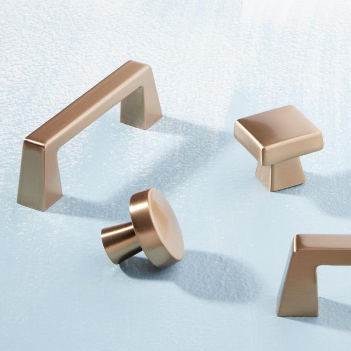 Bauman Cabinet Pull and Knobs in Champagne Bronze