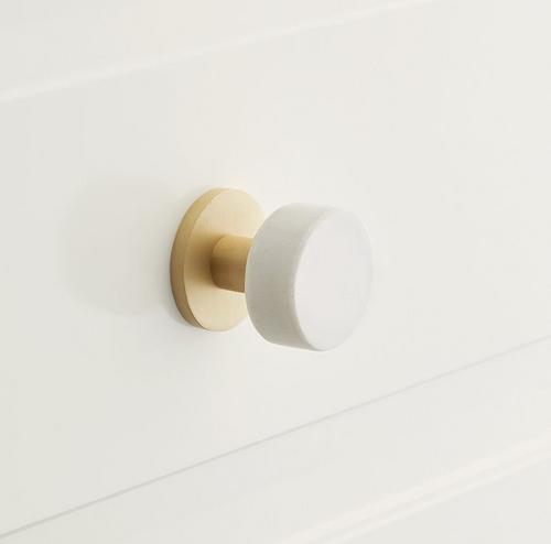 white and gold round cabinet knob