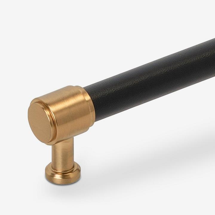 Closeup of Lazzara Cabinet Pull Black Leather in Brushed Gold