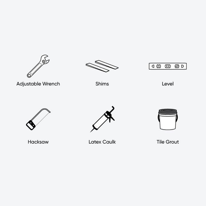 toilet installation tools and materials - adjustable wrench, shim, level, hacksaw, latex caulk, and tile grout