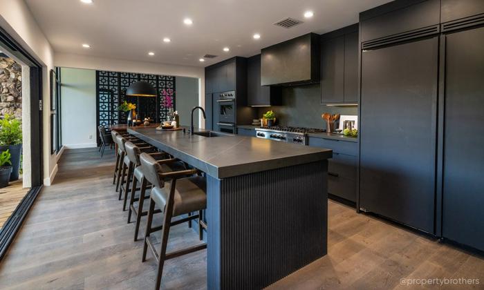 Industrial style kitchen with the Ravenel Pull-Down Kitchen Faucet with Concealed Sprayer in Matte Black