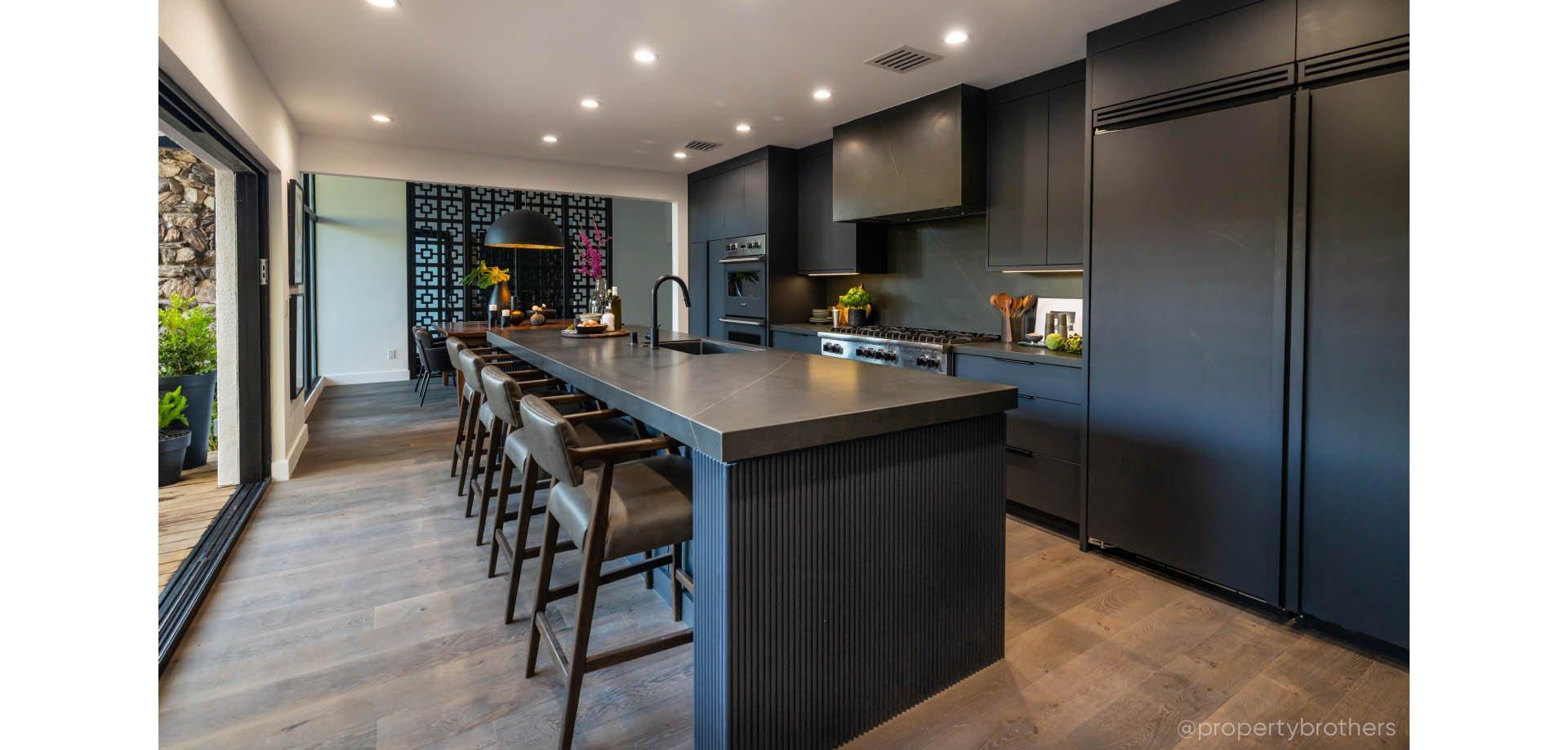 Industrial style kitchen with the Ravenel Pull-Down Kitchen Faucet with Concealed Sprayer in Matte Black