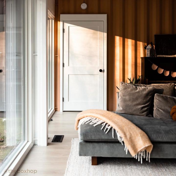 Industrial living room with Moceri Solid Brass Privacy Interior Door Set in Matte Black