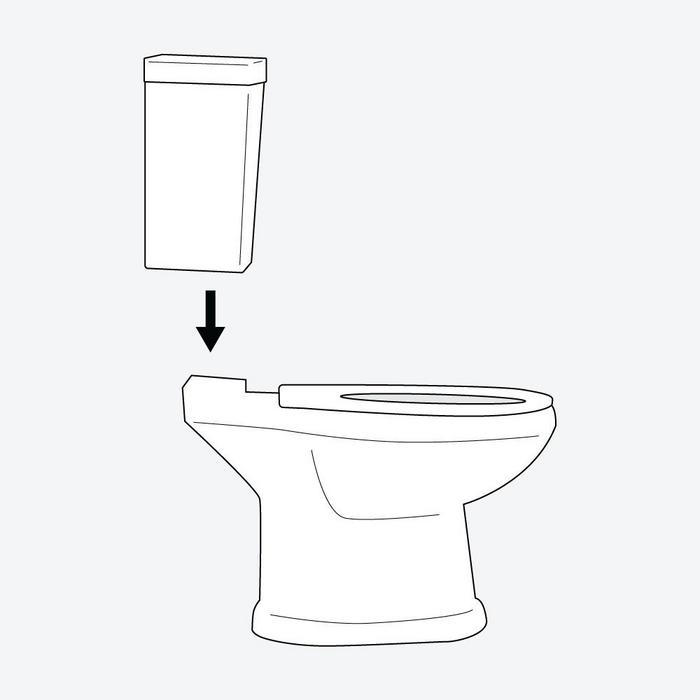 Installation step 6 - slide the tank bolts through the mounting holes on top of the base of the toilet