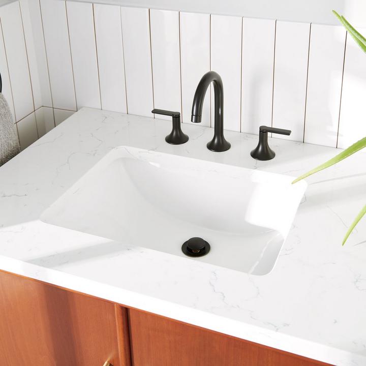 Undermount sink with the Lentz Widespread bathroom Faucet in Matte Black