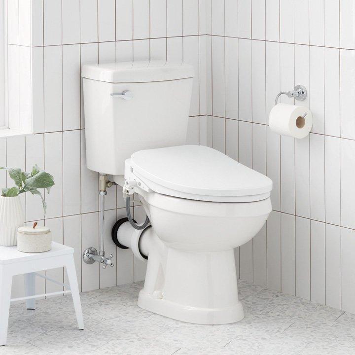 bathroom with corner toilet