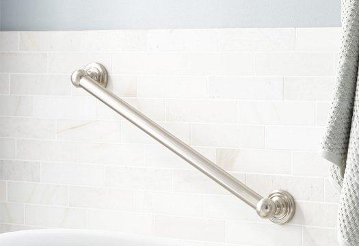 Grab bar above freestanding bathtub