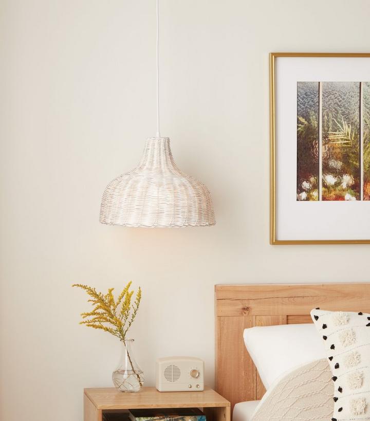 bedroom with rustic straw pendant light