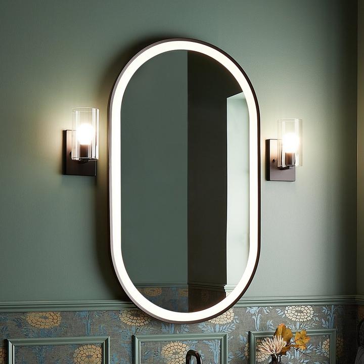 Art deco style bathroom with the Faysel Oval Lighted Mirror in Matte Black Powder Coat