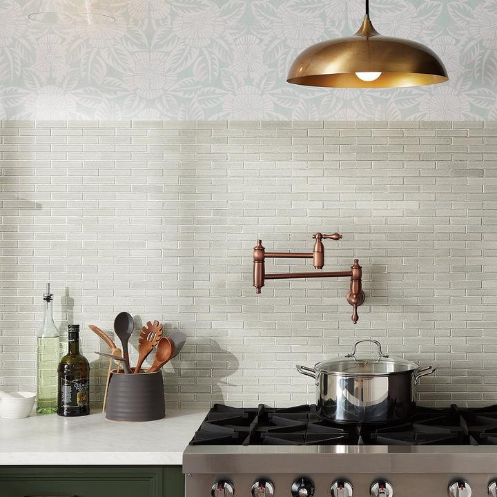 mid-century kitchen design with the Augusta Wall-Mount Pot Filler in Antique Copper, Blackthorne Pendant Light in Aged Brass