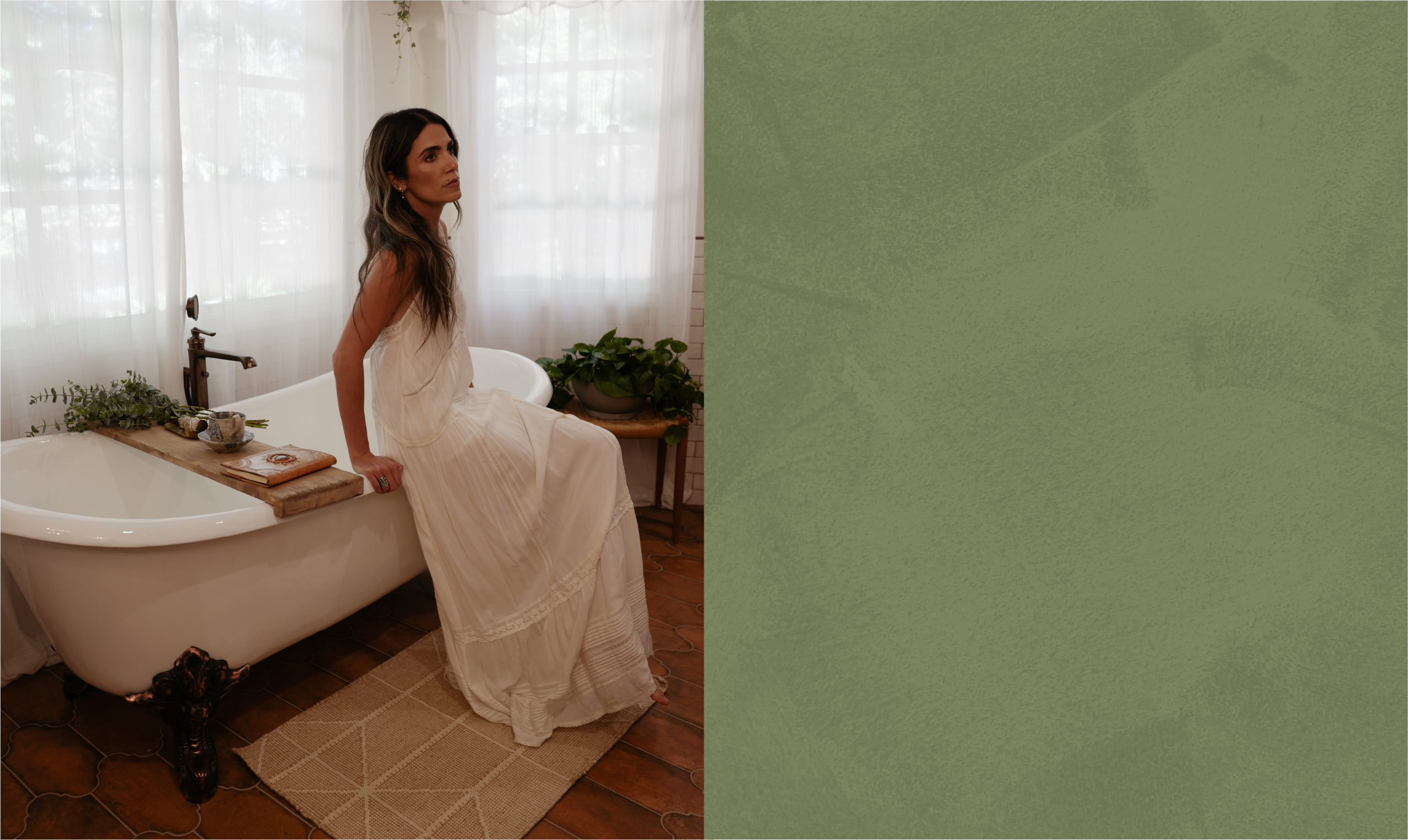 Nikki Reed sitting on the 72 inch Lena Cast Iron Clawfoot Tub