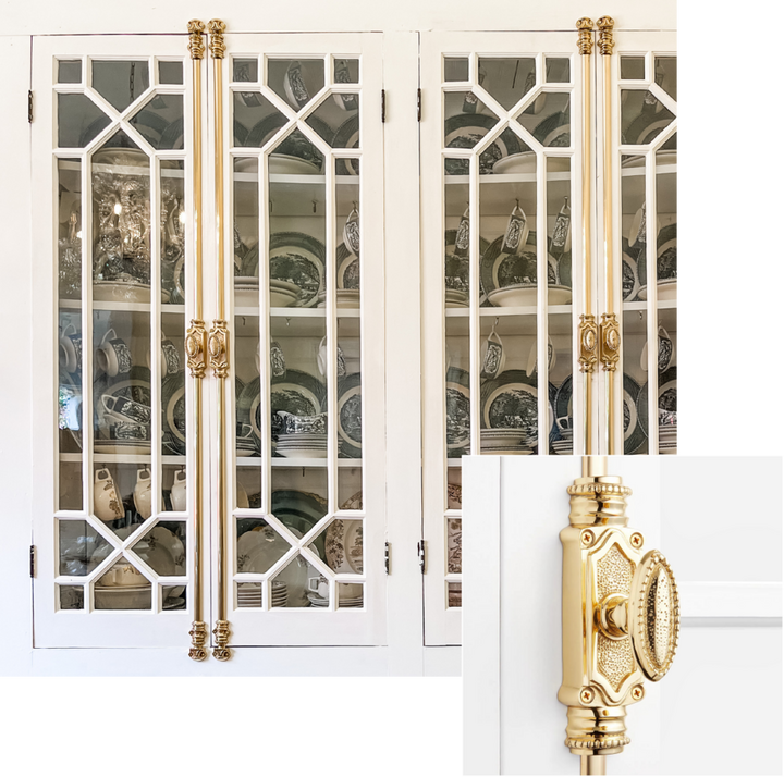 cabinet doors with gold cremone bolts