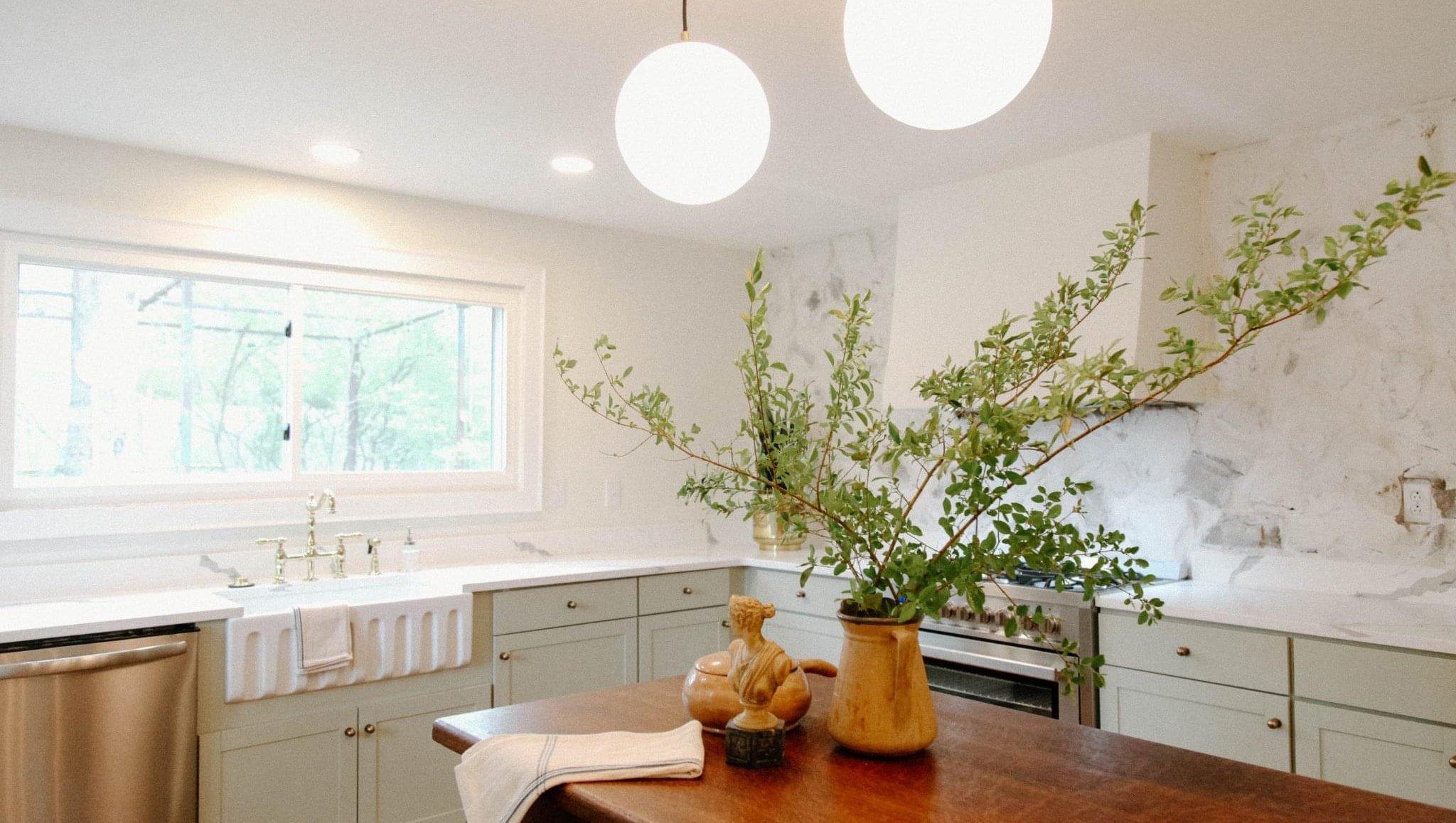 rustic kitchen with farmhouse sink and pendant lights