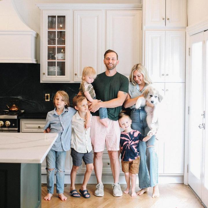 Adam & Jessica Miller of Old House Adam with their family in a kitchen featuring the Cipullo Round Cabinet Knob in Antique Brass