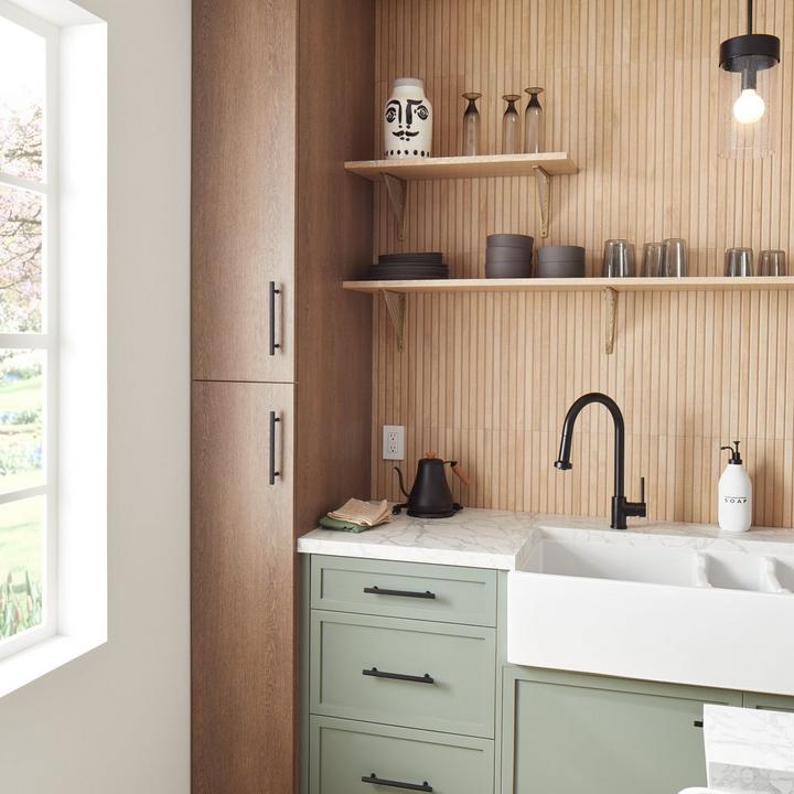 Hidden kitchen with the Ridgeway Pull-Down Kitchen Faucet & Brixlee Reeded Brass Cabinet Pull in Matte Black