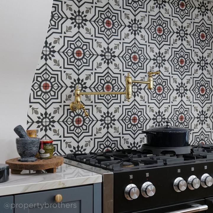 Kitchen designed by the property brothers with the Augusta Retractable Wall-Mount Pot Filler in Polished Brass