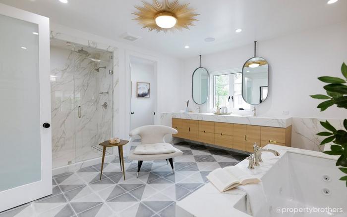 Bathroom designed by the Property Brothers with the Sitka Drop-In Tub, Beasley Bathroom Faucet & Tub Faucet in Polished Nickel