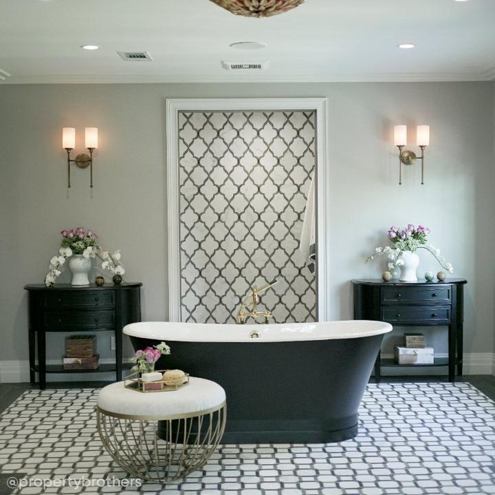Bathroom designed by the Scott Brothers with the 67" Kateryn Skirted Tub in Black, Sebastian Freestanding Tub Faucet in Chrome