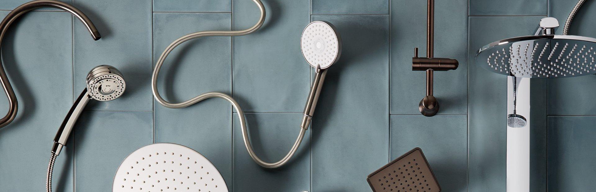 flat lay of various shower heads and other bathroom hardware