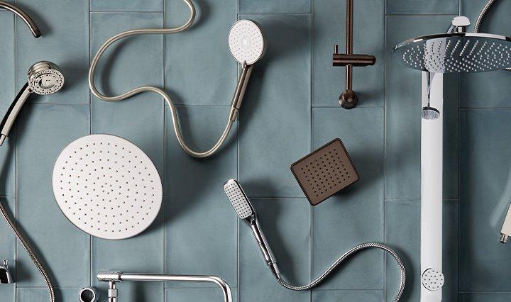 flat lay of various shower heads and other bathroom hardware