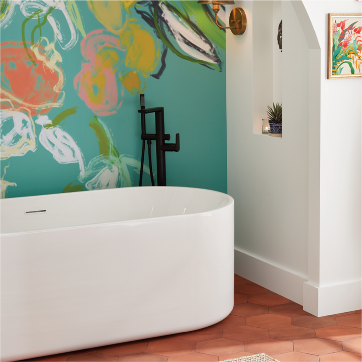 bathroom with freestanding tub and black tub faucet