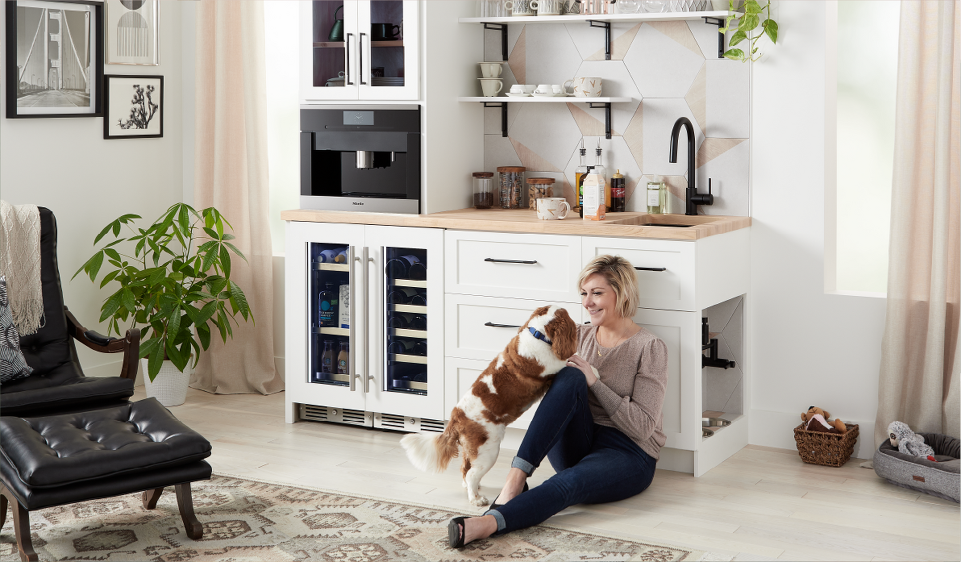 woman in modern kitchen with a dog