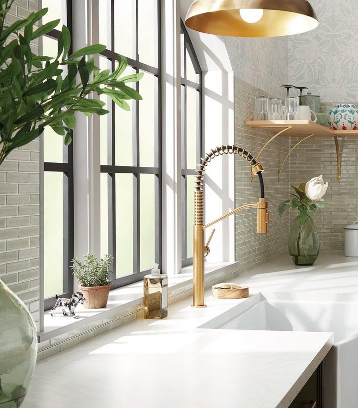 farmhouse kitchen sink with gold spring spout faucet